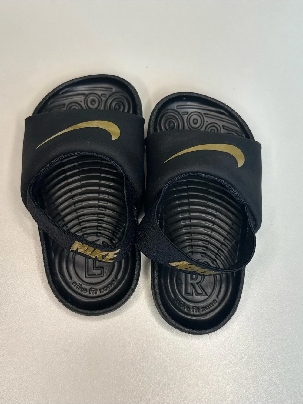 Nike Kids Black Slides with Gold Swoosh